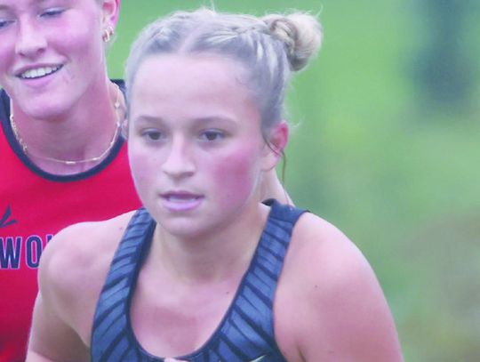 Runners race past rainy days